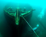 Bow of EB Allen with diver below.