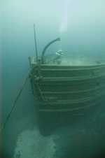Diver on bow of Florida near davit.