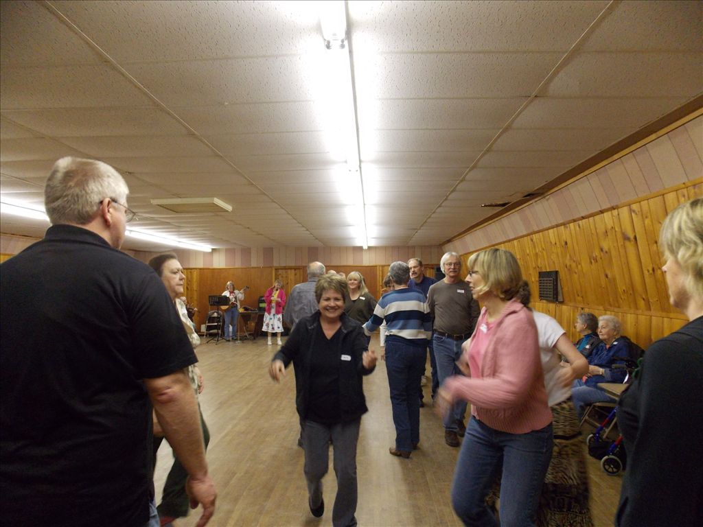 This is called contra dancing, because two lines face each other during part of the dance,  opposite or, in Latin, contra, each other.