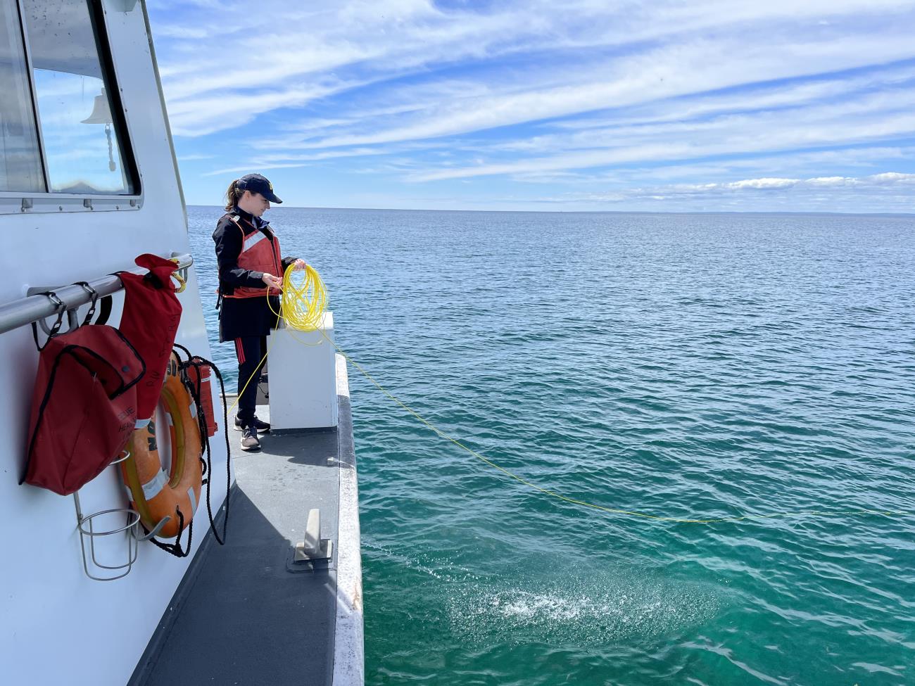 Dr. Katie Skinner tending an ROV from NOAA RV Storm