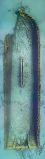 Photomosaic of hull showing centerboard trunk and portside bow collision damage.