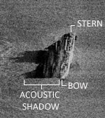 Side scan sonar image showing hull and acoustic shadow produced by the vertical relief of the wreck.